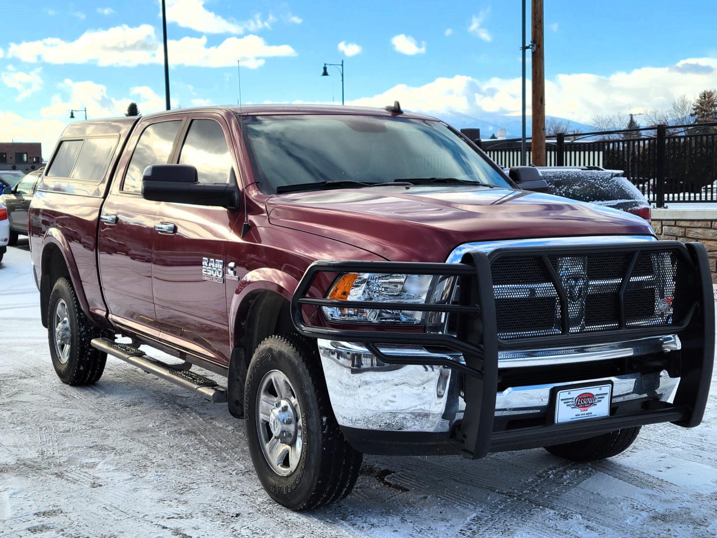 2018 Maroon /Black RAM 2500 SLT (3C6UR5DL4JG) with an 6.7 L Cummins Turbo Diesel engine, 6-Speed Automatic transmission, located at 450 N Russell, Missoula, MT, 59801, (406) 543-6600, 46.874496, -114.017433 - Only 12,839 Miles. Mint Condition/ 4 Wheel Drive. 6.7L Cummins Turbo Diesel. 6 Speed Automatic Transmission. Matching Topper. Touchscreen Display. AM FM Bluetooth. Power Drivers Seat. Air. Cruise. Tilt. Power Windows and Locks. Backup Camera. - Photo#7